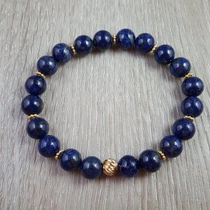 Blue lapis stretch bracelet with 14/20 gold filled twist bead